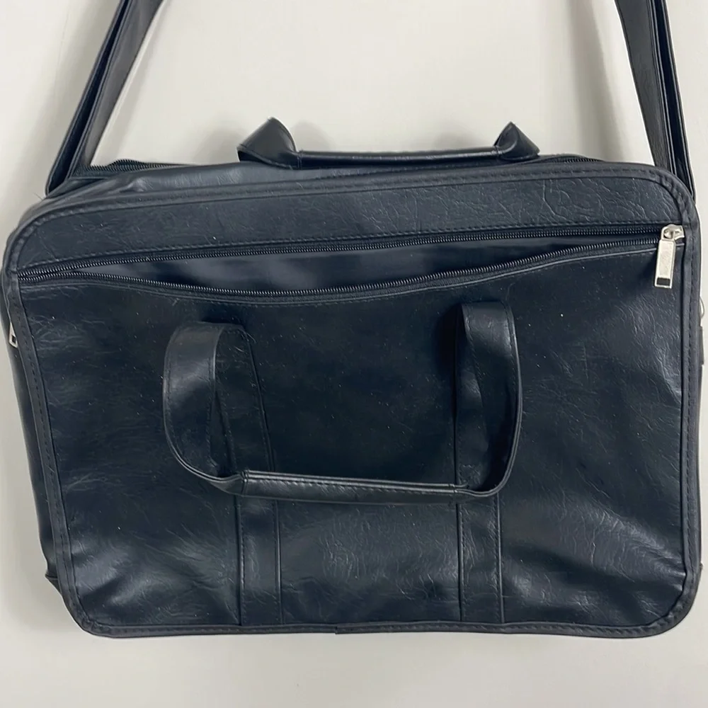 Soft bodied faux leather briefcase lots of pockets and crossbody strap